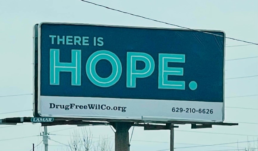 Billboard reading There is HOPE. DrugFreeWilCo.org 629-210-6626