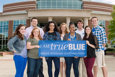 photo of students holding True Blue sign